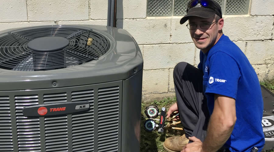Quality Heating And Cooling Tech Reparing Ac Unit