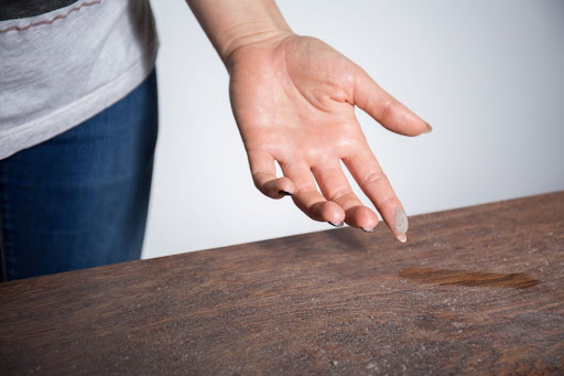 A close-up of a hand and dust.